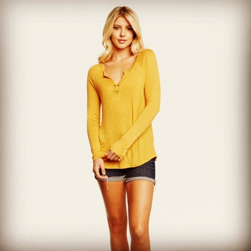 Yellow and Oatmeal colored shirts.